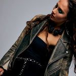 Model in distressed leather jacket wearing Signature Silver Chain Belt & Necklace by Märta Larsson. Silver chain styled with punk-inspired accessories — expressive and confident look.