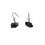 The Raw One Black Tourmaline Earrings Silver.The Raw One Black Tourmaline Earrings by Märta Larsson with wire-wrapped raw stones and silver hooks. Minimalist crystal earrings — rugged beauty meets refined craftsmanship.