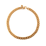Handcrafted gold collar necklace by Märta Larsson displayed on white background.