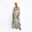 Luxury aqua silk kaftan dress by Märta Larsson with deep V-neckline and elegant flowing drape.