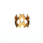 Product image of the MMM Polished Gold Vermeil Ring by Märta Larsson, displayed against a white background. This bold 10 mm statement ring in polished 24 carat gold vermeil on recycled sterling silver features a repeating “M” logo design. A handcrafted designer silver ring ideal for pairing with luxury accessories or styling with silk kaftan dresses.
