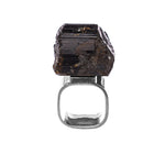 Black Tourmaline Obelisk Ring by Märta Larsson in polished silver, displayed against a white background. This silver tourmaline ring combines raw crystal energy with minimalist design, ideal for lovers of handcrafted Swedish jewelry and bold gemstone rings.