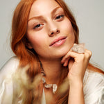 Model wearing Not A Pearl Necklace Rough Quartz Point by Märta Larsson with matching crystal ring. Raw quartz necklace styled for confident elegance and natural glow.