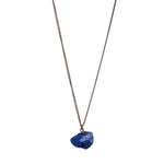 The Raw One Lapis Lazuli Necklace by Märta Larsson with raw ultramarine crystal pendant on gold vermeil chain. Lapis lazuli necklace handcrafted in Stockholm — bold, saturated, and sculptural.