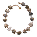 Not a Pearl Necklace Calcite Pyrite by Märta Larsson with chunky raw calcite pyrite stones linked by 14k rolled gold. Statement crystal necklace handcrafted in Stockholm — bold, earthy, and unforgettable.