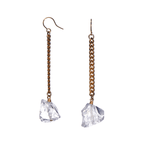 Keep Me Hanging Rough Quartz Earrings by Märta Larsson with raw quartz stones and gold-plated chain. Long crystal drop earrings handcrafted in Stockholm — minimalist, radiant, and bold.