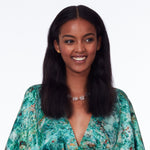 Model wearing Not A Pearl Necklace Rough Quartz by Märta Larsson with patterned outfit and joyful expression. Chunky quartz necklace styled for vibrant fashion and personality.