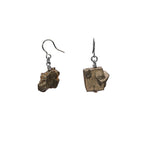 Raw pyrite drop earrings by Märta Larsson in recycled sterling silver, featuring natural mineral texture and handcrafted metallic edge.
