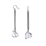 Keep Me Hanging Rough Quartz Earrings by Märta Larsson with silver ear wire and raw quartz drops. Statement earrings — handcrafted and shimmering with raw texture.