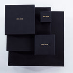 Roxx Pyrite Crystal Ring by Märta Larsson displayed in black branded packaging. Elegant box presentation for handcrafted gemstone rings and luxury accessories.