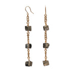 Longing Shiny Pyrite Earrings by Märta Larsson with gold ear wire and raw pyrite stones. Statement crystal earrings — handcrafted and shimmering with natural texture.