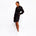 Side view of a model wearing the Carte Blanche Silk Shirt Dress by Märta Larsson, photographed against a white background. This elegant silk shirt dress features a crisp collar and relaxed fit, ideal for styling as a luxury womenswear piece or modern caftan-inspired look.
