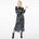 Front view of a model wearing the Glam Rock Silk Satin Shirt Dress by Märta Larsson, photographed against a white background. This oversized satin shirt dress features a button-through front, crisp collar, and relaxed fit — a bold fashion dress for women perfect for luxury styling and modern rock & roll flair.