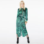 Model posing in the Glam Rock Silk Satin Shirt Dress by Märta Larsson, showing the full front view. The relaxed fit and waist tie offer versatile styling, making this satin shirt dress a standout piece in luxury womens fashion.