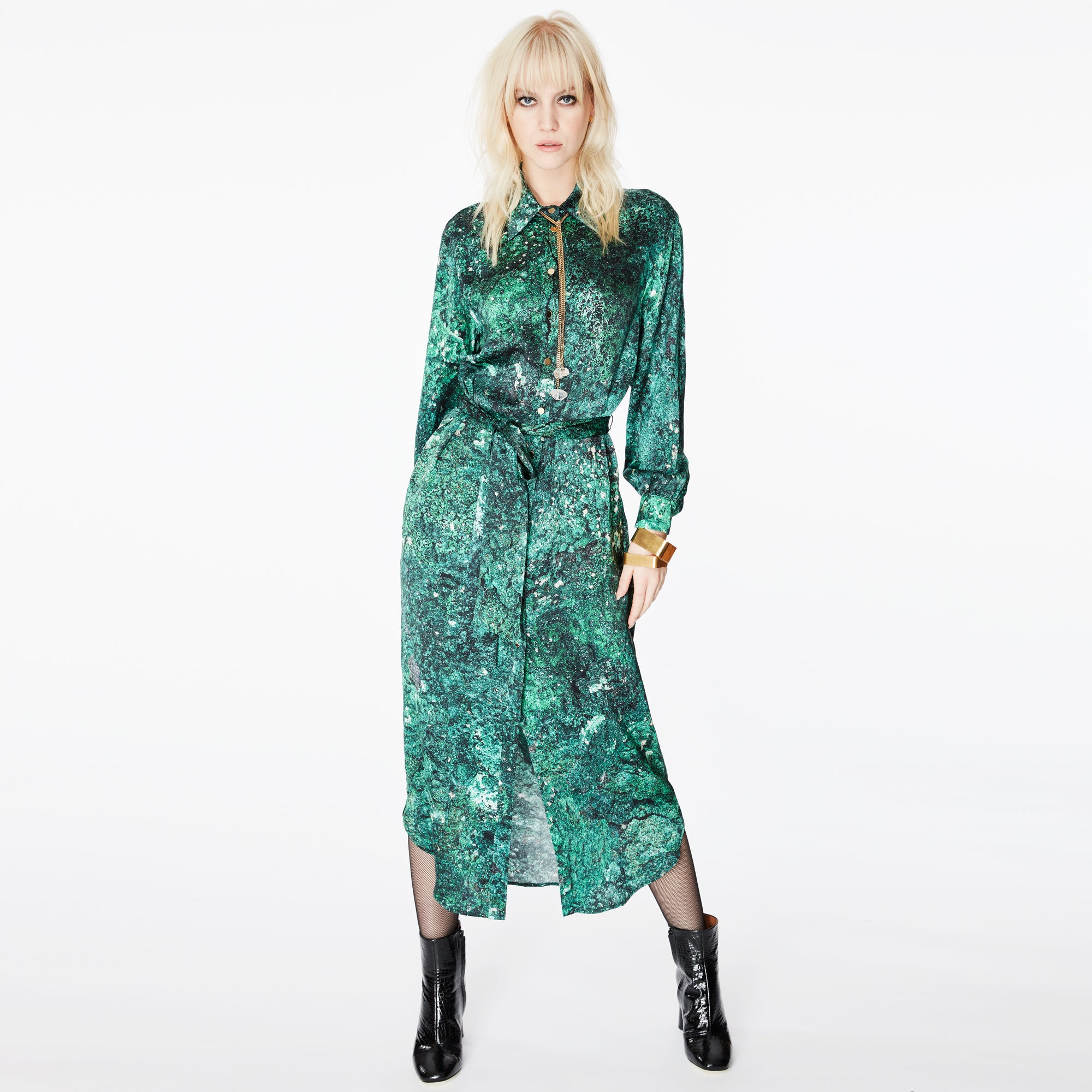 Model posing in the Glam Rock Silk Satin Shirt Dress by Märta Larsson, showing the full front view. The relaxed fit and waist tie offer versatile styling, making this satin shirt dress a standout piece in luxury womens fashion.