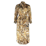 Flat lay of the Glam Rock Silk Satin Shirt Dress by Märta Larsson, displayed against a white background. The clean front design and luxurious silk satin fabric reflect the timeless appeal of elegant shirt dresses for women.