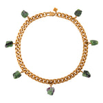 Collar Ruby Zoisite Necklace by Märta Larsson with seven raw ruby zoisite stones on gold-plated collar chain. Green and pink crystal necklace handcrafted in Stockholm — bold, earthy, and sculptural.