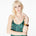 Front view of a model wearing the Paradis Silk Satin Camisole by Märta Larsson, photographed against a white background. This luxury camisole top for women features a scoop neckline and skinny straps, crafted in 100% silk satin. A modern designer camisole perfect for layering with fashion jewelry or styling for elegant nights out.