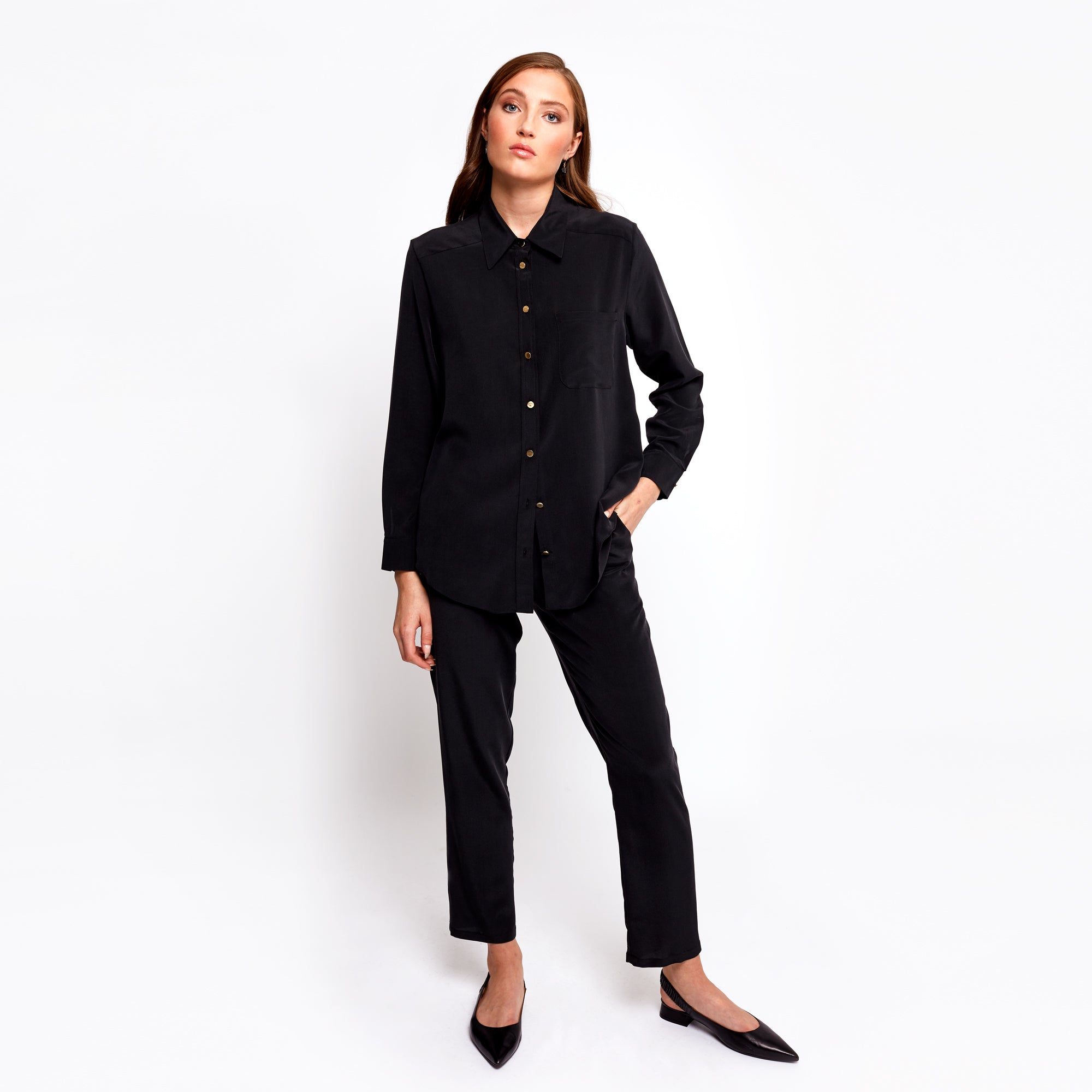 Model posing in the Boyfriend Silk Shirt by Märta Larsson, showing the front of the shirt with expressive styling. The relaxed fit and silk texture make it a standout piece for pairing with modern mens jewelry or unique men's jewelry collections.