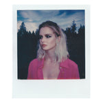 Polaroid-style image of a model wearing the Boyfriend Silk Shirt by Märta Larsson in a forest setting. The shirt’s oversized fit and natural drape offer a refined alternative to traditional menswear, ideal for styling with mens silver jewellery or fashion jewelry for men.