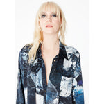 Close-up front view of a model wearing the Boyfriend Silk Satin Shirt by Märta Larsson, with focus near the face. The silk satin texture and casual elegance make it a versatile piece for pairing with mens signet rings or fashion jewelry for men seeking a laid-back luxury look.