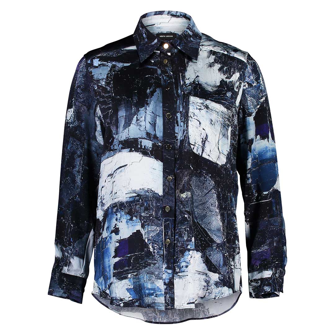 Flat lay of the Boyfriend Silk Satin Shirt by Märta Larsson, displayed against a white background. This relaxed-fit shirt in silk satin offers a refined alternative to traditional mens shirts, perfect for pairing with mens luxury jewellery or statement accessories for men.