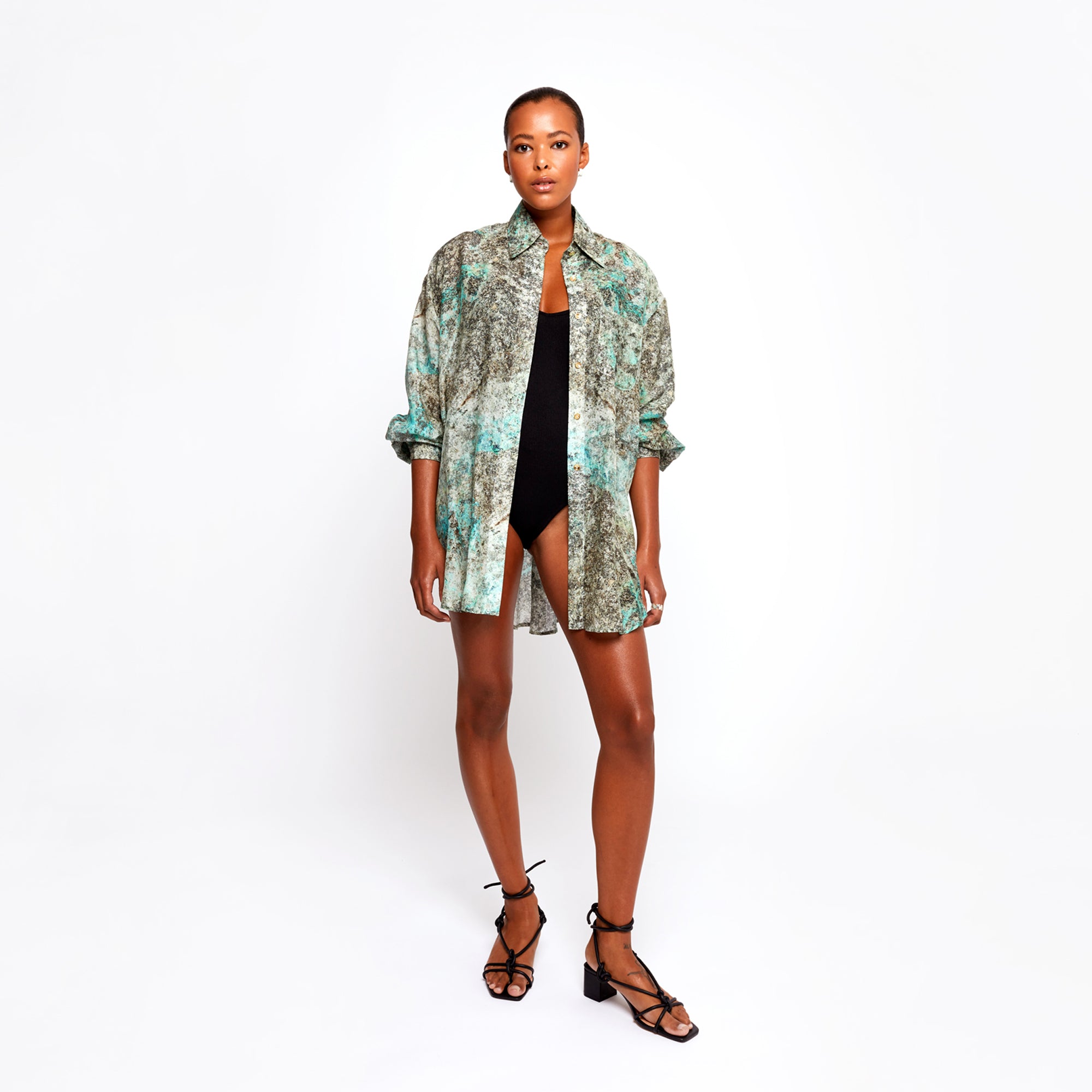 Model wearing the Winona Shirt Dress by Märta Larsson, showing the full front view against a white background. The relaxed fit and flowing fabric make it a versatile piece for both beachwear and office power dressing — a true modern kaftan dress.