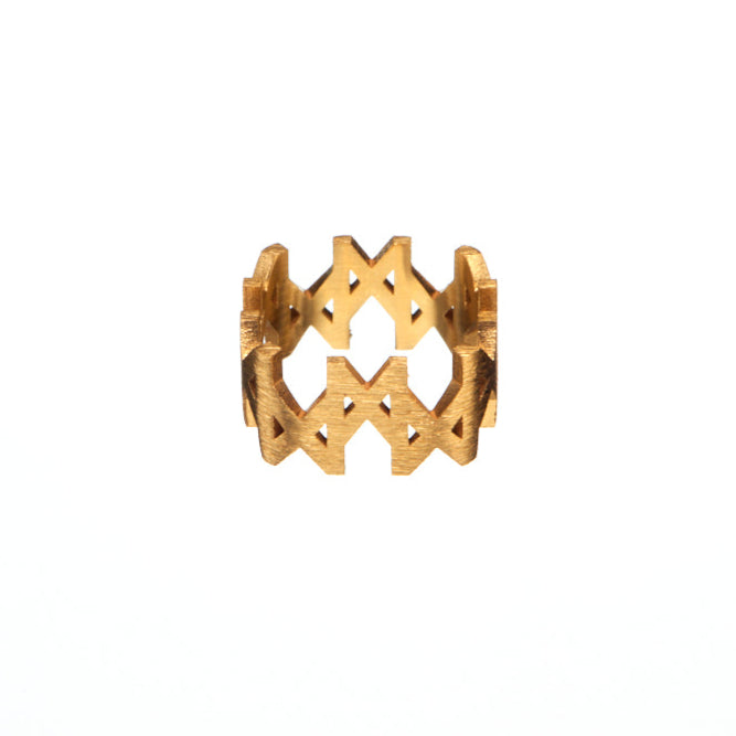  MMM brushed gold vermeil ring by Märta Larsson, featuring a bold geometric logo design and matte finish on a wide band.
