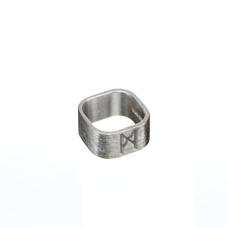 Signature brushed silver ring by Märta Larsson with engraved logo and matte finish, featuring a bold square shape and modern design.