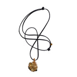 Bondage Pyrite Gold Pendant Necklace by Märta Larsson featuring a raw pyrite crystal wrapped in copper wire, handcrafted with natural strength.