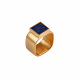  Mondrian Ring Lapis Lazuli by Märta Larsson in gold vermeil, displayed against a white background. Square-cut lapis lazuli stone set in 24k gold-plated recycled silver — bold designer ring with deep blue elegance.
