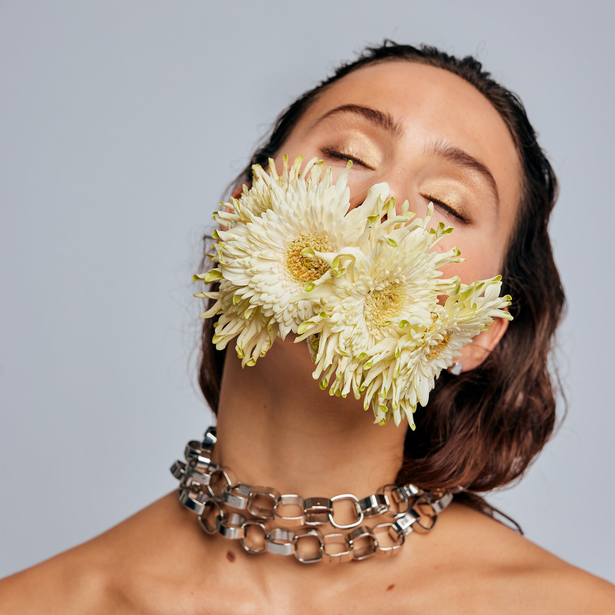 Signature Silver Chain Belt & Necklace by Märta Larsson styled as a choker with chrysanthemum flowers, a polished statement silver chain with artistic edge.