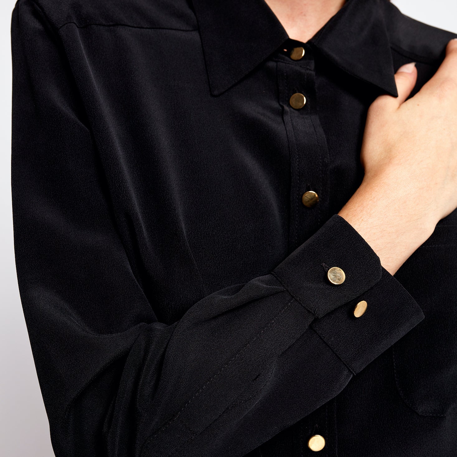 Close-up of the Boyfriend Silk Shirt by Märta Larsson in 100% sand-washed silk showcasing soft texture, fine stitching, and oversized modern menswear design