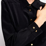 Close-up of the Boyfriend Silk Shirt by Märta Larsson in 100% sand-washed silk showcasing soft texture, fine stitching, and oversized modern menswear design