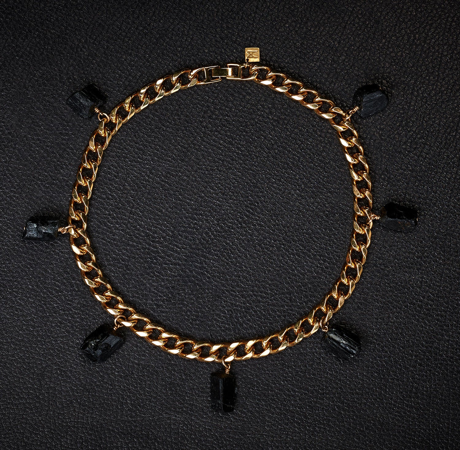 Collar Black Tourmaline Necklace by Märta Larsson in gold with rugged crystal charms, a bold natural-texture statement necklace.