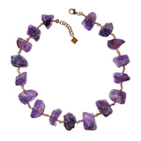 Not A Pearl Necklace Amethyst by Märta Larsson with chunky raw amethyst stones linked by 14k rolled gold. Statement crystal necklace handcrafted in Stockholm — bold, radiant, and unforgettable.
