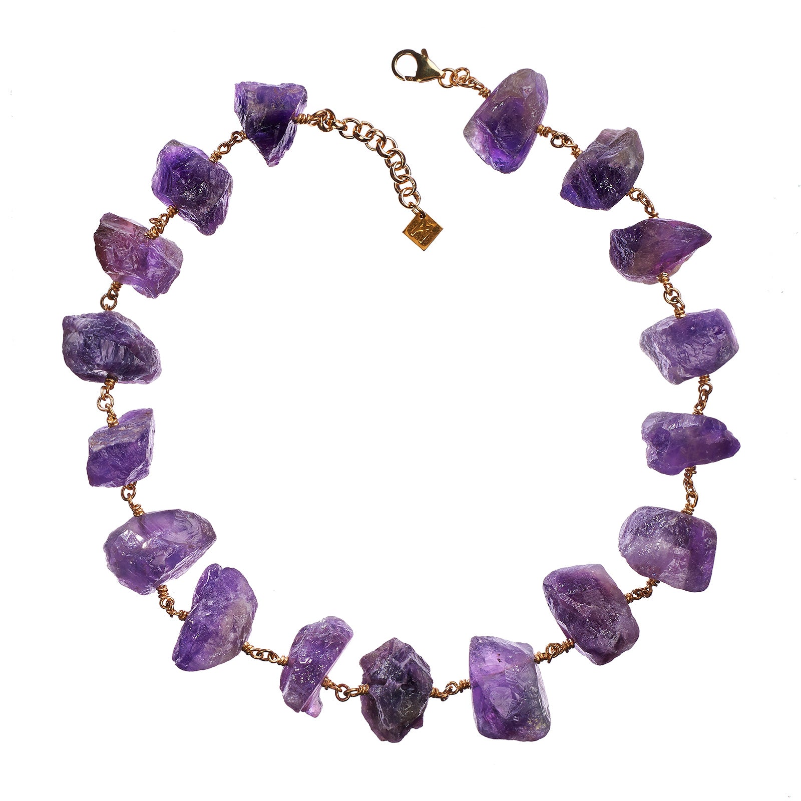 Not A Pearl Necklace Amethyst by Märta Larsson with chunky raw amethyst stones linked by 14k rolled gold. Statement crystal necklace handcrafted in Stockholm — bold, radiant, and unforgettable.
