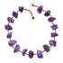 Not A Pearl Necklace Amethyst by Märta Larsson with chunky raw amethyst stones linked by 14k rolled gold. Statement crystal necklace handcrafted in Stockholm — bold, radiant, and unforgettable.
