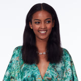 Model wearing the Not a Pearl Necklace Rough Quartz by Märta Larsson with a patterned outfit and joyful expression, styled with vibrant, expressive elegance.