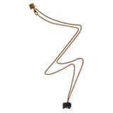 The Raw One Black Tourmaline Necklace by Märta Larsson featuring a raw black tourmaline pendant on a gold-vermeil chain, handcrafted with bold natural texture.
