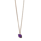 The Raw One Amethyst Necklace by Märta Larsson with raw purple crystal on a gold-vermeil chain, a bold modern handcrafted piece.