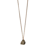 The Raw One Pyrite Necklace by Märta Larsson with raw pyrite crystal on a gold-vermeil chain, a bold minimalist handcrafted piece.