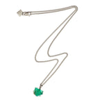 The Raw One Necklace by Märta Larsson featuring a silver chain and raw green fluorite stone, displayed on a white background.