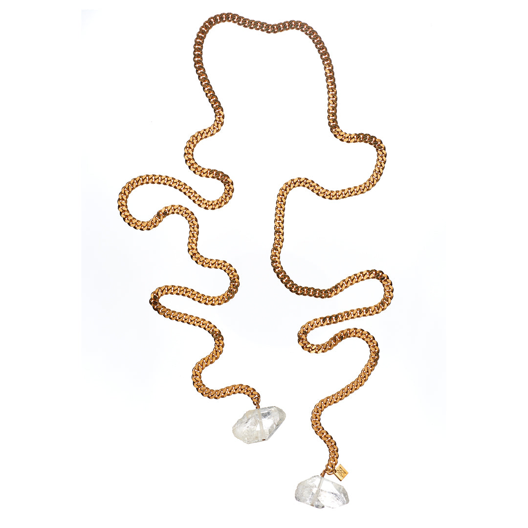 Tie Me Up Quartz Necklace by Märta Larsson featuring raw clear quartz crystals on a gold-plated lariat chain, a handcrafted sculptural statement piece.