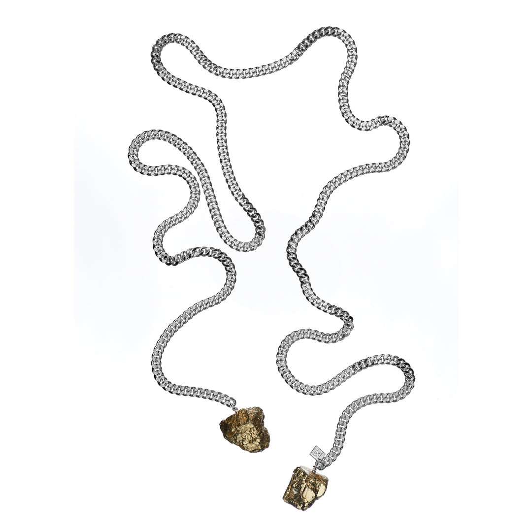 Tie Me Up Pyrite Necklace by Märta Larsson in silver with raw pyrite pendants, styled for a modern, sculptural edge.