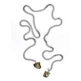 Tie Me Up Pyrite Necklace by Märta Larsson in silver with raw pyrite pendants, styled for a modern, sculptural edge.
