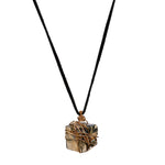 Bondage Pyrite Gold Pendant Necklace by Märta Larsson featuring a polished pyrite crystal wrapped in copper wire, styled with earthy elegance.