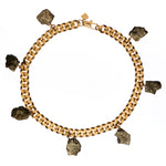 Collar Pyrite Necklace by Märta Larsson featuring seven raw pyrite crystal charms on a gold-plated collar chain, bold and sculptural.