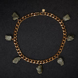 Collar Pyrite Necklace by Märta Larsson laid out on black textured surface. Gold collar necklace with raw pyrite stones — edgy, refined, and handcrafted.
