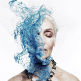 Model wearing the Not a Pearl Necklace Calcite Pyrite by Märta Larsson with a surreal blue overlay, styled for artistic power and expressive fashion.